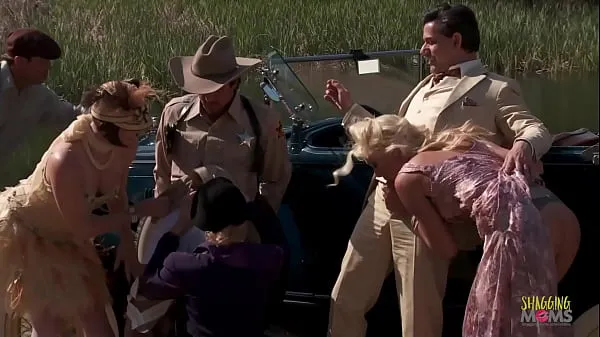 XXX Copper tries to apprehend the thieves but he is outnumbered. As they tie him down, they decide to celebrate. The milfs gather around outside and eagerly await the men to ravage them during group sex teplá trubice