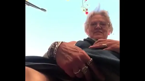 XXX Grandma shows big slit outside warme buis