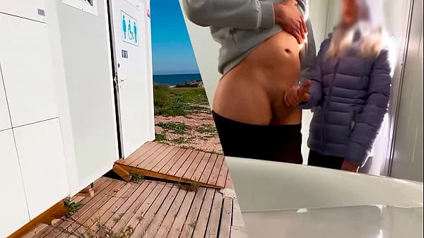 XXX I surprise a girl who catches me jerking off in a public bathroom on the beach and helps me finish cumming warm Tube